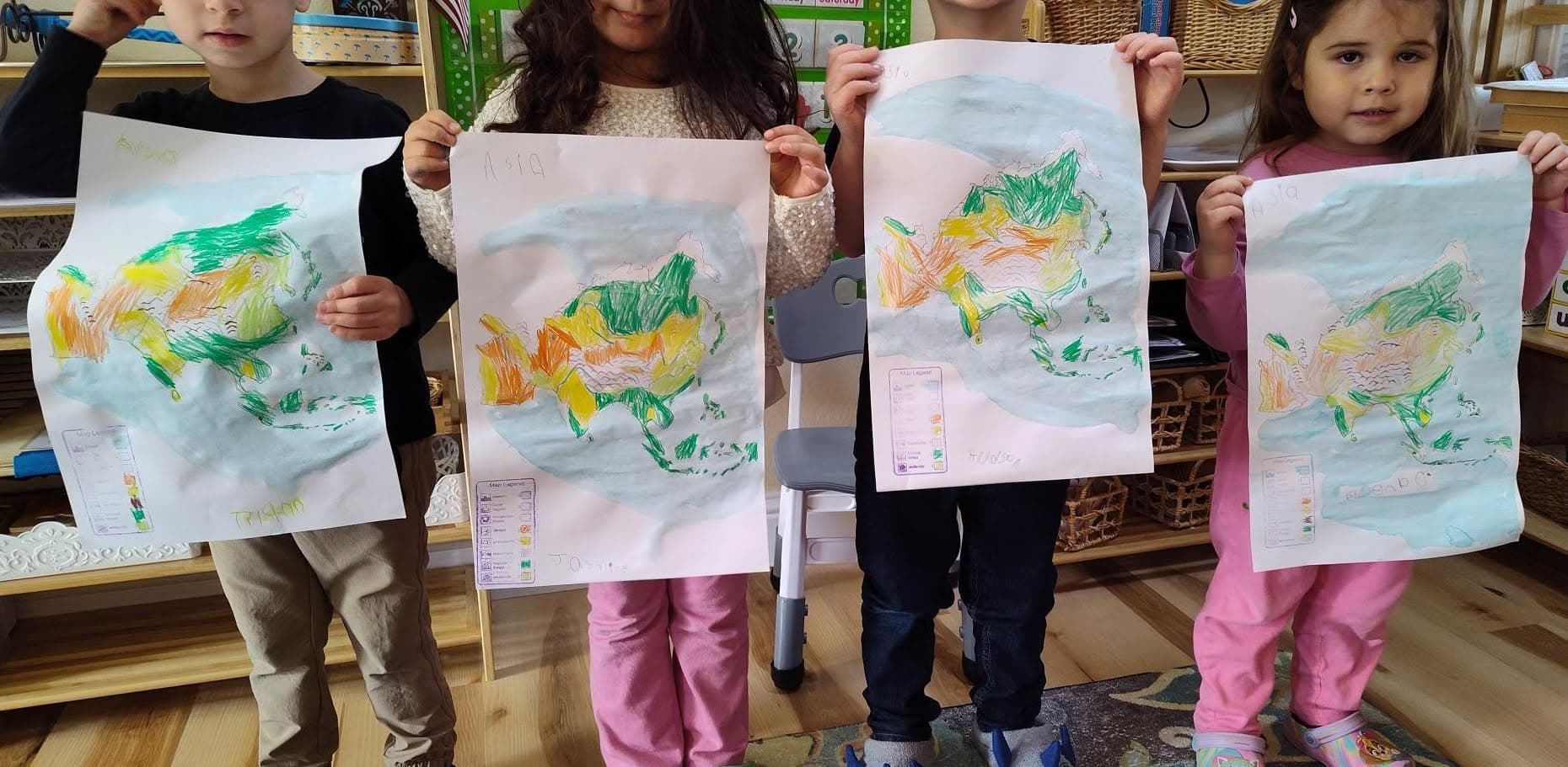 Children working with Asia biome maps