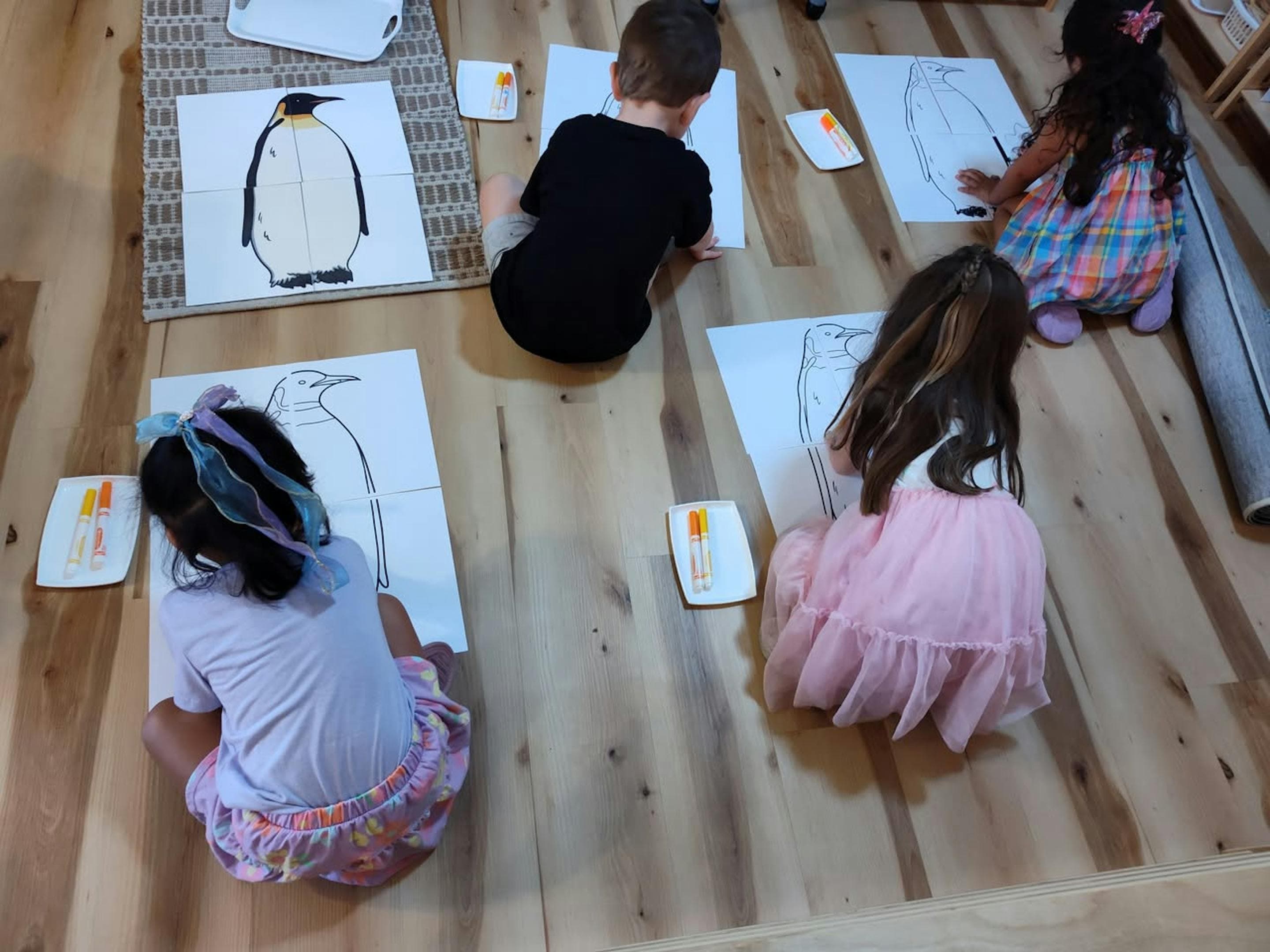 Children making big penguins