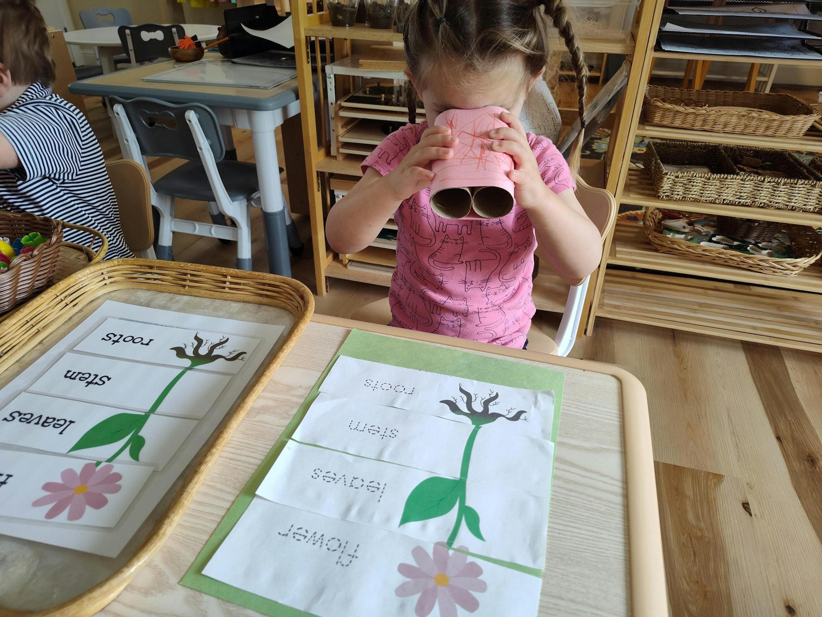 Using binoculars to study parts of a plant