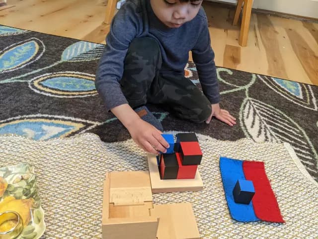 Child building the binomial cube